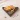 Dried orange cinnamon bay star anise clove and rosemary in wooden triangle tray